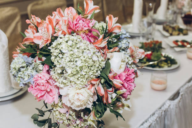 istock beautiful decorated centerpiece table with hydrangea bouquets in vases and greenery at luxury wedding reception in restaurant. stylish decor and adorning 961795026