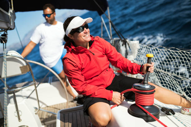 istock Attractive strong woman sailing with her boat 961797146