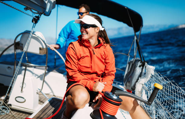 istock Attractive strong woman sailing with her boat 961797220