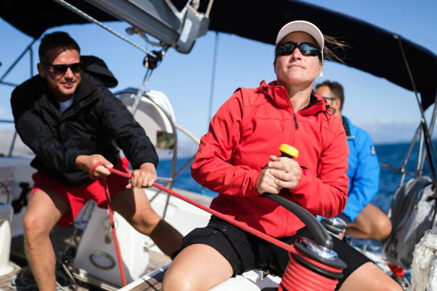 istock Attractive strong woman sailing with her boat 961797270