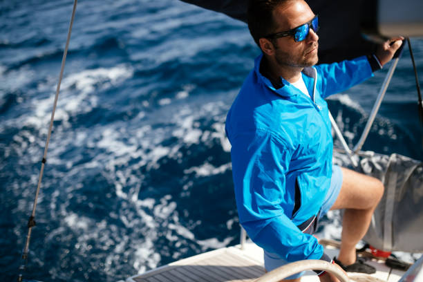 istock Handsome strong man sailing with his boat 961797398