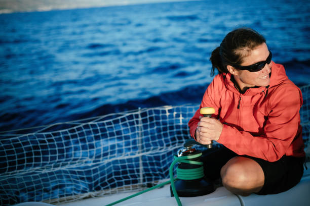 istock Attractive strong woman sailing with her boat 961798060