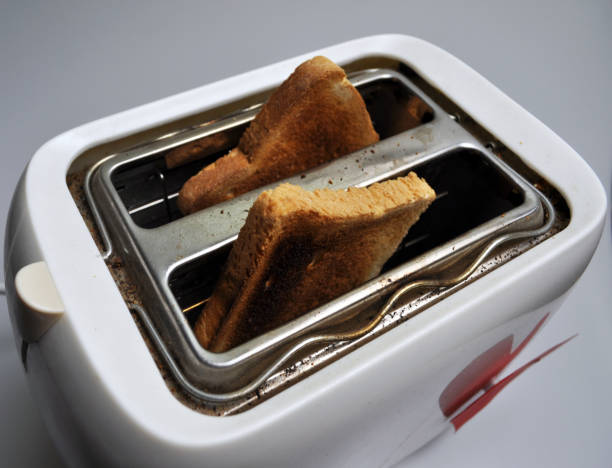 istock two toasted toast in a white toaster 961799568