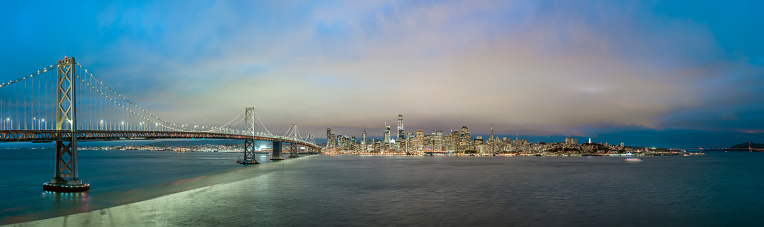 Blue hour panorama of San Francisco skyline with Bay Bridge