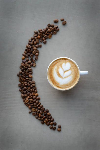 istock Cups of cappuccino and coffee beans 961804544