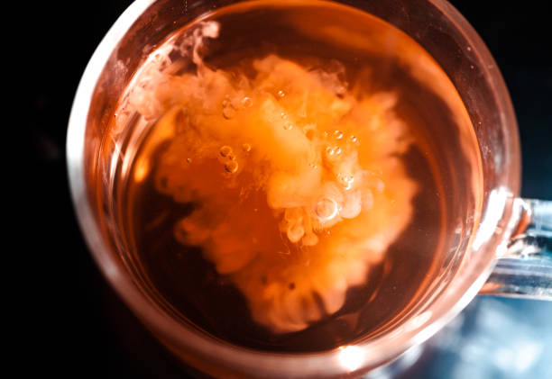 istock A nice warm cup of tea, shot in a studio, milk swirls in tea 961807876