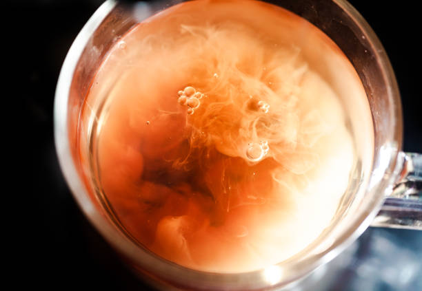 istock A nice warm cup of tea, shot in a studio, milk swirls in tea 961808652