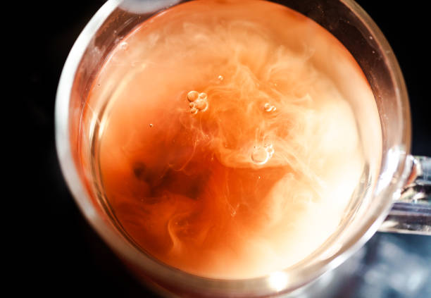 istock A nice warm cup of tea, shot in a studio, milk swirls in tea 961808744