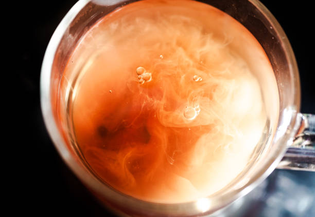 istock A nice warm cup of tea, shot in a studio, milk swirls in tea 961812702
