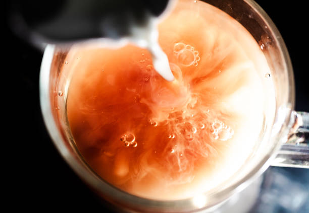 istock A nice warm cup of tea, shot in a studio, milk swirls in tea 961812868