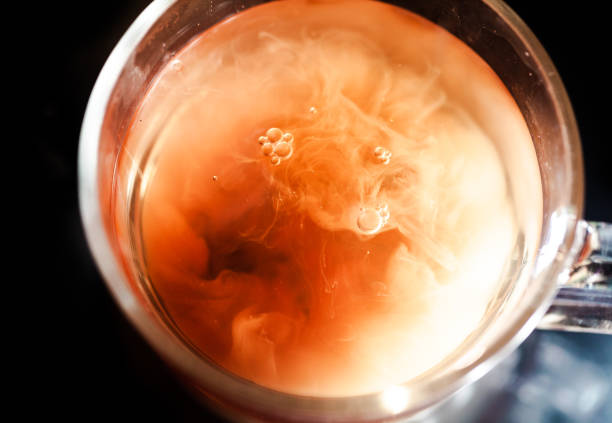 istock A nice warm cup of tea, shot in a studio, milk swirls in tea 961812932