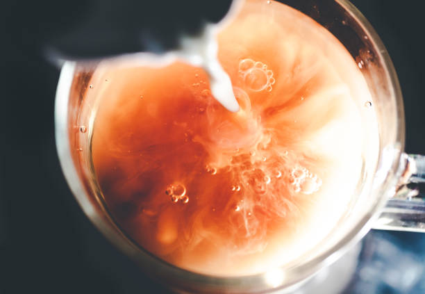 istock A nice warm cup of tea, shot in a studio, milk swirls in tea 961813152