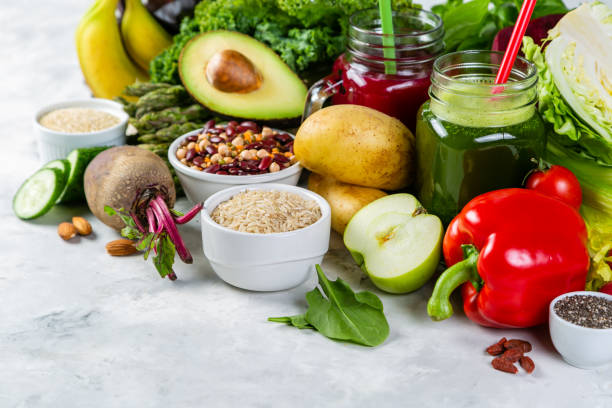 Alkaline diet concept - fresh foods on rustic background