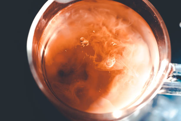 istock A nice warm cup of tea, shot in a studio, milk swirls in tea 961815028