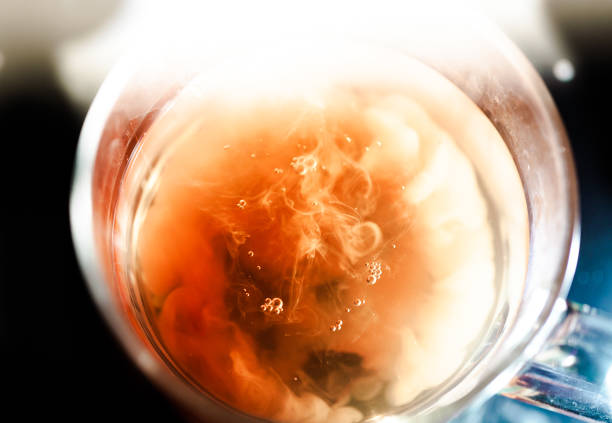 istock A nice warm cup of tea, shot in a studio, milk swirls in tea 961815268