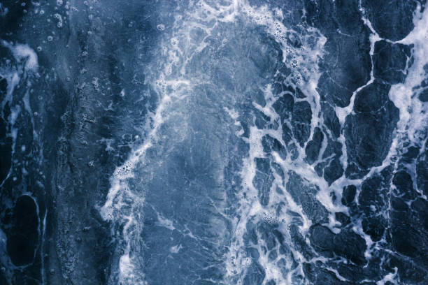 istock Abstract blue background white veins, ocean wave, bubble and foam at high tide, pattern 961823012