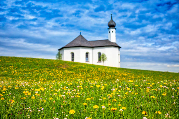 istock Idyllic landscape with small church in the Alps (HDRi) 961823742