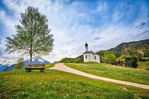 High Dynamic Range shot of the Alp mountains with a small Sankt Anna church on the hill; Achenkirch, Austria