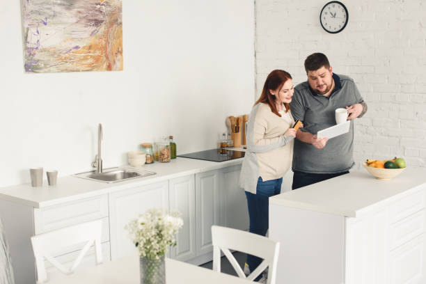 istock boyfriend and girlfriend shopping online in kitchen 961824204