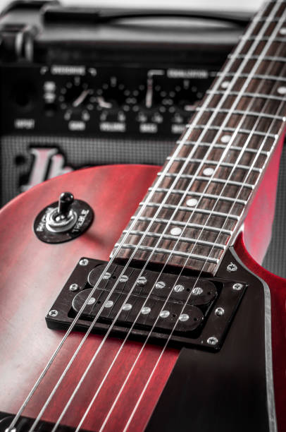 istock Part electric guitar and classic amplifier on a dark background 961826408