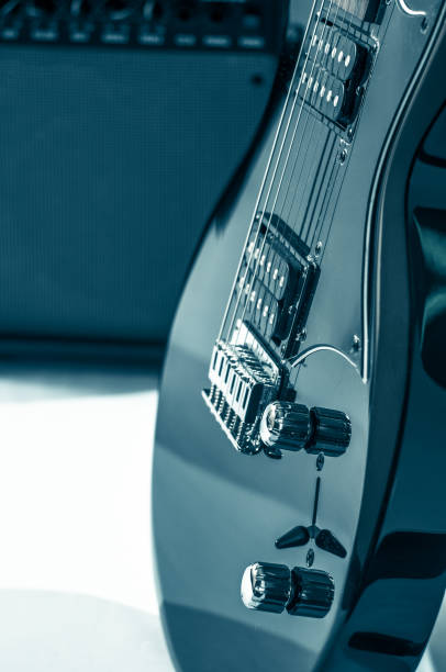 istock Part electric guitar and classic amplifier on a dark background 961826524