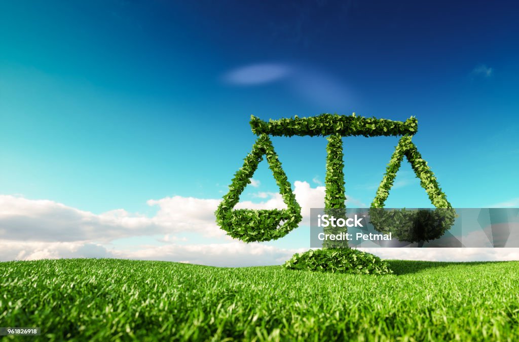 Eco friendly law, politics and eco balance concept. 3d rendering of scale icon on fresh spring meadow with blue sky in background. Law Stock Photo