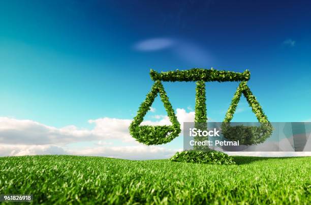 Eco Friendly Law Politics And Eco Balance Concept 3d Rendering Of Scale Icon On Fresh Spring Meadow With Blue Sky In Background Stock Photo - Download Image Now