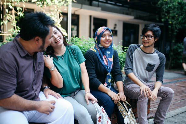 istock Young people in Kuala Lumpur hanging out together 961828866