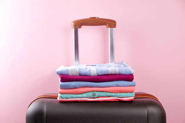 istock Composition with folded clothes, unisex for both man and woman, different color & material. Trip preparation concept. 961836584