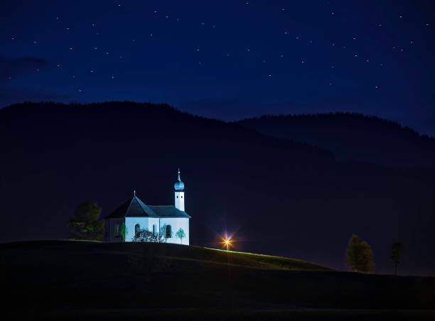 istock Idyllic landscape with small church in the Alps (HDRi) 961836864