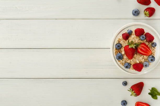 istock Healthy breakfast on white wooden table, top view 961837464