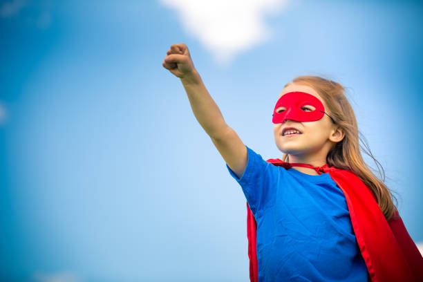 istock Funny little girl playing power super hero. 961837476
