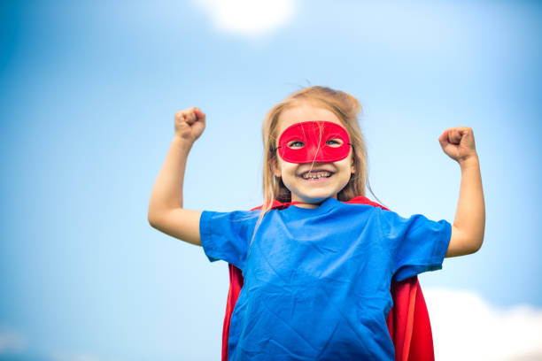istock Funny little girl playing power super hero. 961837532