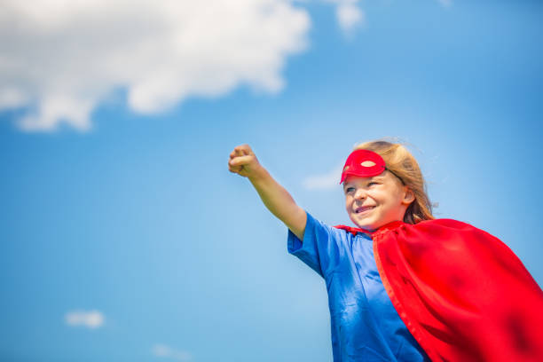 istock Funny little girl playing power super hero. 961837600