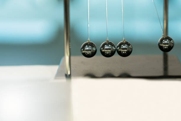 istock Balancing Balls Newton's Cradle on blurred backgrounds 961838296