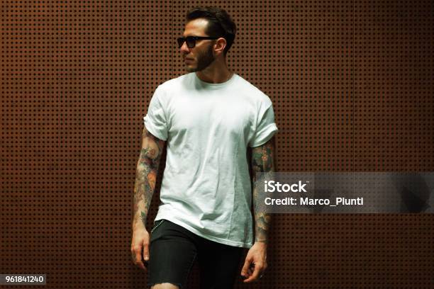 Portrait Of Tattooed Young Man Stock Photo - Download Image Now - Men, T-Shirt, Tattoo