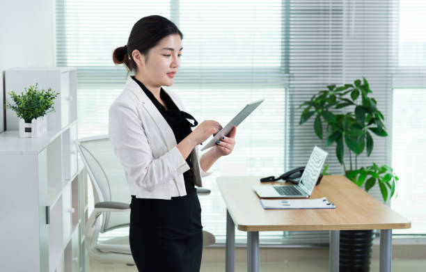 istock Businesswoman using digital tablet in her office 961846488