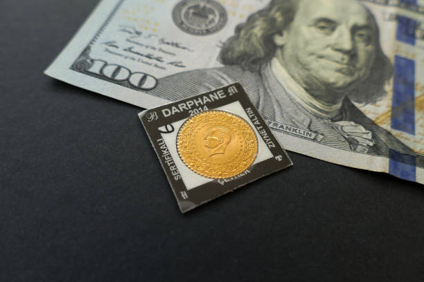 istock turkish quarter gold and hundred USA dollars. 961847054
