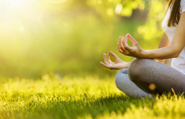 istock Yoga woman meditating at sunset 961849612