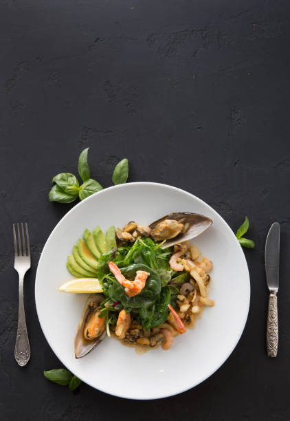 istock Warm salad with grilled seafood flat lay 961857044