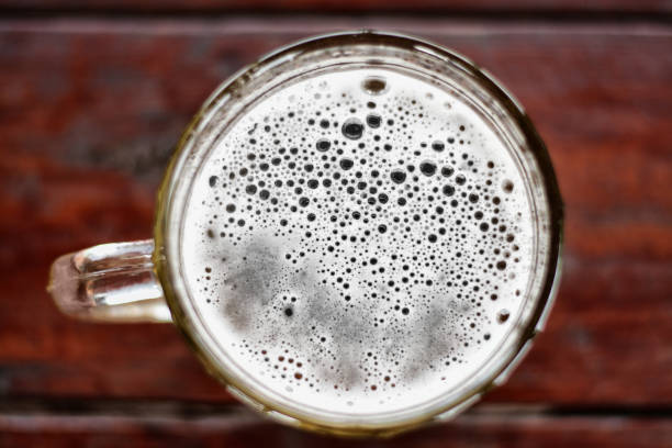 istock large mug of beer with foam and bubbles top view 961861108