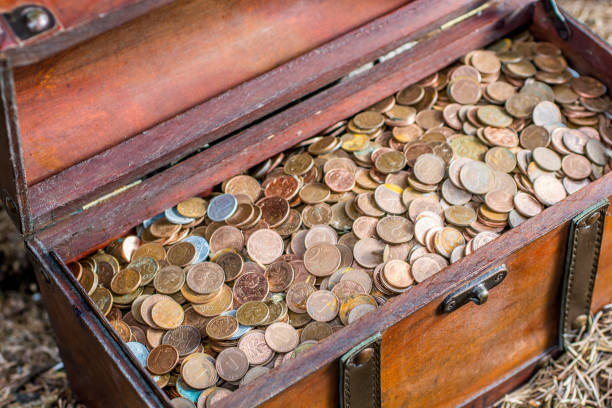 istock Treasure chest filled with coins 961866010