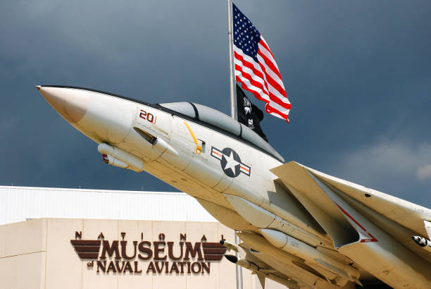Pensacola, FL, USA September 15, 2011 An F14 appears to soar outside of the National Museum of Naval Aviation in Pensacola, Florida.  The museum is dedicated to military aircraft and aviation