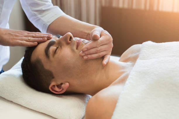istock Man getting professional facial massage at spa salon 961867442