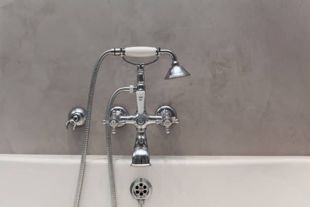 istock Bright bathroom with new textured wall and plumbing. 961867458