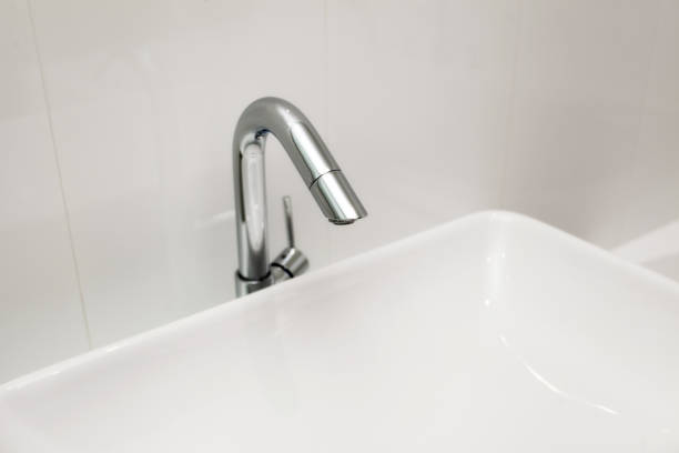 istock Element of bathroom interior. New wash basin, white sink and tile. 961867600