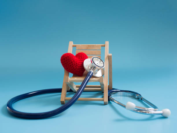 istock red heart using deep blue stethoscope on the blue background. Concept of love and caring patient by the heart or get sick on traveling. Copy space for the text and contents 961870390
