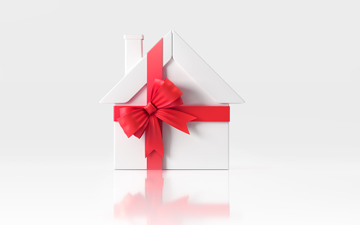 White house icon wrapped with red ribbon on white background. Horizontal composition  with clipping path and copy space.  Real Estate Concept.