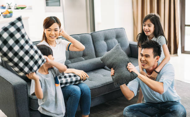 istock Family having pillow fight 961881492