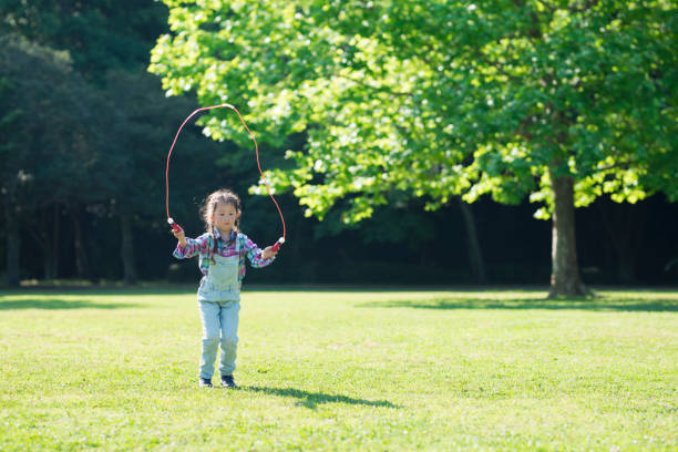 istock Girl playing with a jump rope 961885620